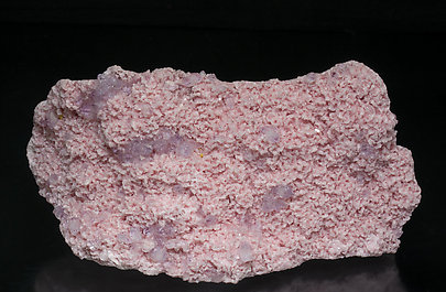 Rhodochrosite with Quartz (variety amethyst) and Helvine.