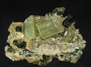 Fluorapatite with Stilbite-Ca and Arfvedsonite.