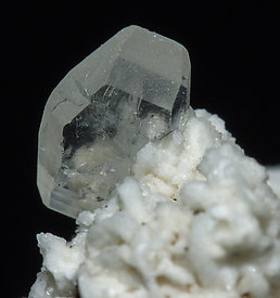 Stokesite with Albite, Microcline, smoky Quartz and Muscovite. 