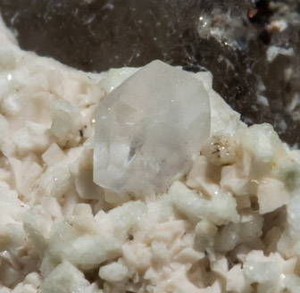 Stokesite with Albite, Microcline, smoky Quartz and Muscovite. 