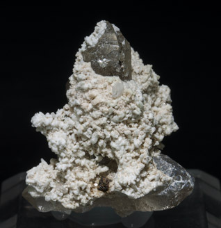 Stokesite with Albite, Microcline, smoky Quartz and Muscovite.