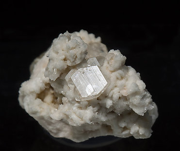 Stokesite with Albite, Microcline, smoky Quartz and Muscovite.