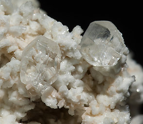 Stokesite with Albite, Microcline, smoky Quartz and Muscovite. 