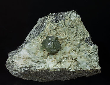 Prehnite with Orthoclase (variety adularia), Epidote and Amphibole.